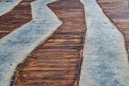 Concrete Pathway with brown wooden floorの写真素材