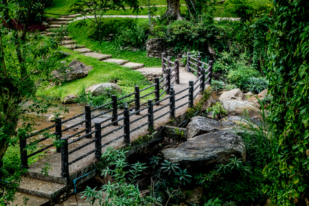 Concrete footbridge with artificial branch railingの写真素材