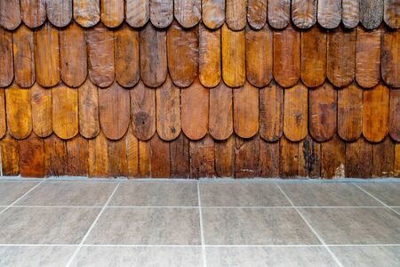 Brown wooden wall with concrete tiles floorの写真素材