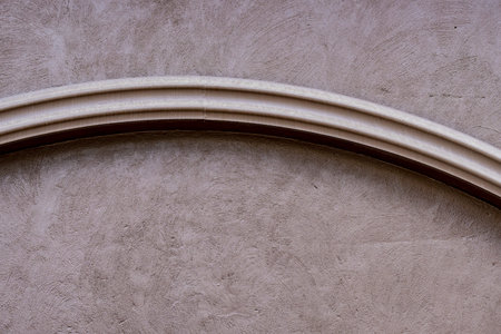 Brown concrete wall with line stucco