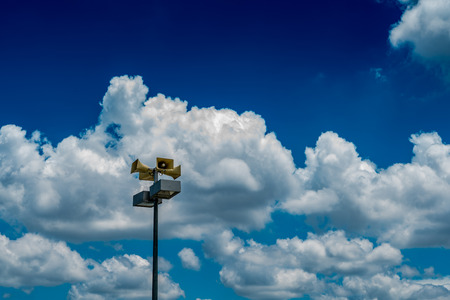 Beige horn speaker on cloudy backgroundの写真素材