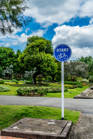 Blue bicycle start sign in the parkの写真素材