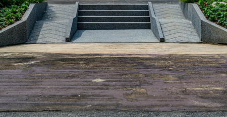 Perspective of concrete with small gravel texture staircase and ramp for wheelchairの写真素材