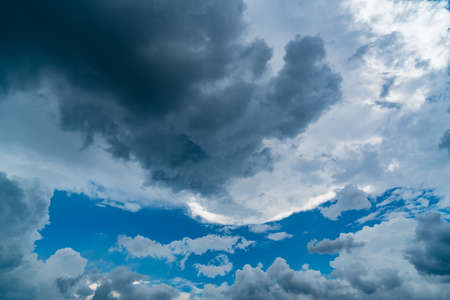 Dark cloud on blue sky backgroundの写真素材