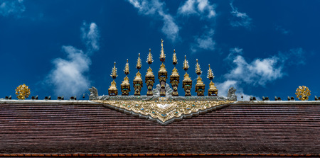 Part of Thai temple roof with blue sky backgroundの写真素材
