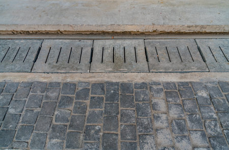 concrete water drain on sidewalk