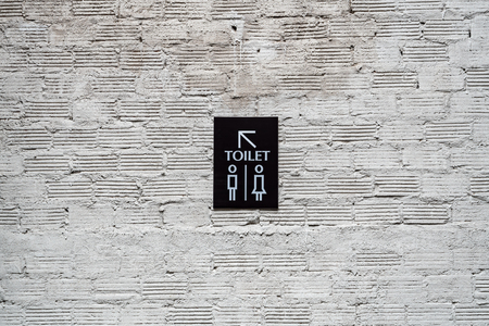 Toilet modern sign label on concrete brick wallの写真素材