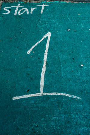 Number one painted on green concrete floorの写真素材