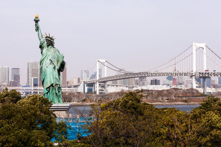 Statue of Liberty and Tokyo Skyscrapers view from Odaiba, Japan