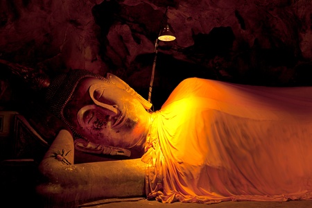 Reclining Buddha statue in the cave, Khao luang, Petchburi, Thailandの写真素材