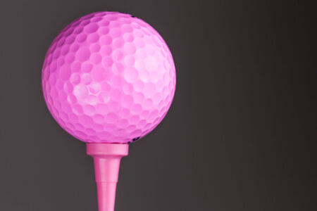 Pink Golf ball on gray backgroundの写真素材