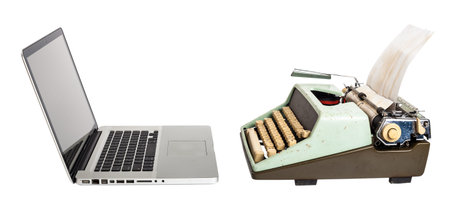 old typewriter against computerの写真素材