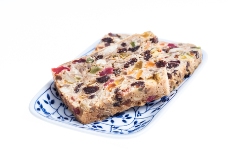 Fruit cake on isolated whiteの写真素材