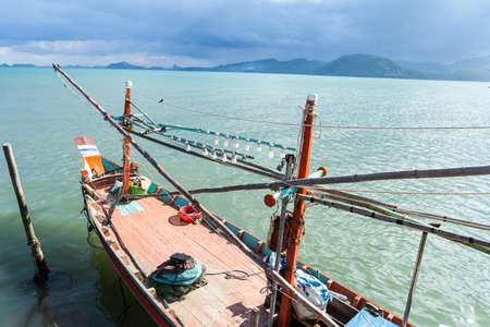 Fishing boat floating at the dockの写真素材