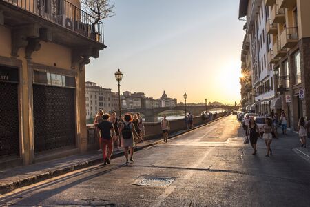 Florence, Italy - July 11, 2015: Tourist walking in front of Ponte Vecchio at Lungarno Accialuoli street, Florence, Tuscany, Italyのeditorial素材
