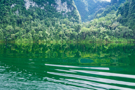 The Nature reflection on water at Ratchaprapha Dam at Khao Sok National Park, Suratthani Province, Thailand.の写真素材