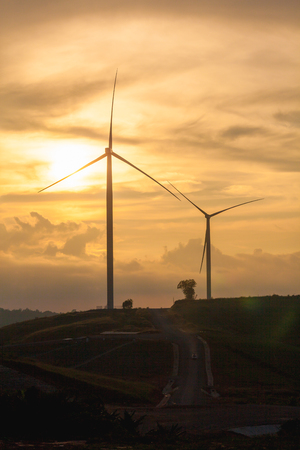 Silhouette of wind Turbine in sunset mood, Pitsanulook, Northern of Thailandの写真素材