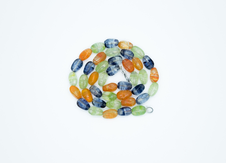 on a white background lies a necklace on the neck with a blue gem as a gift to a beloved womanの写真素材