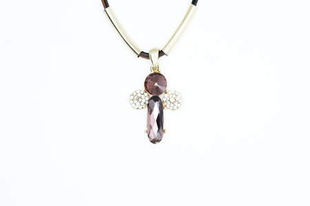 on a white background lies a necklace on the neck with a gem as a gift to a beloved womanの写真素材