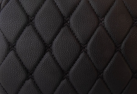 classic black leather Mat with straight black stitching soft leather for machine with textured pattern concept background fabric businessの写真素材