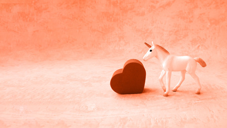 unicorn and heart in romantic coral color of love with toning.の写真素材
