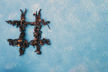 hashtag of tea hibiscus on a bluee background. Food typography. Design element.の写真素材