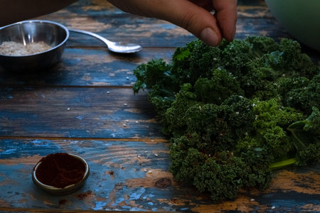 Kale cabbage green salad preparation process handsの写真素材