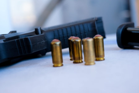 A handgun with bullets symbolizing gun rights while framed against the United States constitution.