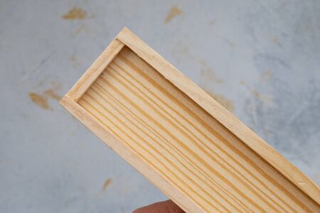 wooden pencil case with colour pencils on a creativ grey background for back to schoolの写真素材