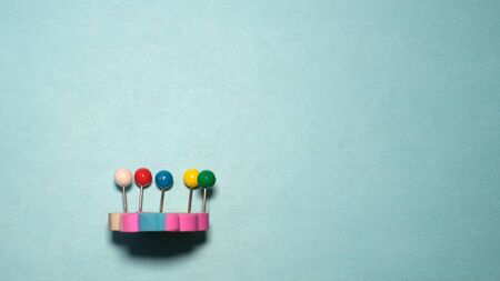 Banner four binder clips isolated on blue background with unicornの写真素材