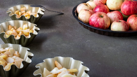 Apple pie in baking dish. Homemade breakfast with apples and a la carte plates. Bright photo. Free...