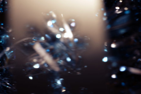 Dark abstract blue bokeh sparkle on black background. Lights of the color background. Defocus different colors lights. Abstract bright blured colored bokeh.の写真素材