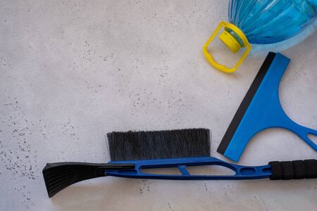 Hand cleaning a car windshield with window cleaner wiper. Wiper blades scraper silicone and hard, glass washing liquid, cleaning from snow. the concept of washing Windows, windshield wiper auto glassの写真素材
