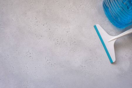 Hand cleaning a car windshield with window cleaner wiper. Wiper blades scraper silicone and hard, glass washing liquid, cleaning from snow. the concept of washing Windows, windshield wiper auto glassの写真素材