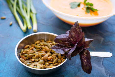 pumpkin seeds purple Basil and green onions. Top view.の写真素材