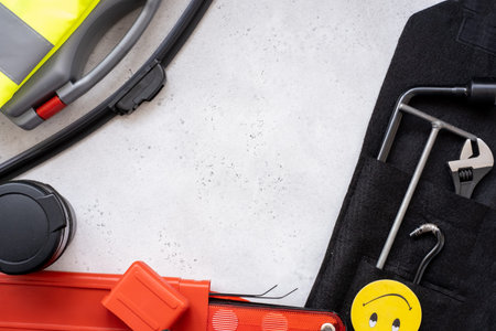 a set of necessary for the car warning sign, first aid kit, reflective vest, metal hook, part of the Jack device, wrench, hexagon and flavor, car ashtray and wiper bladeの写真素材
