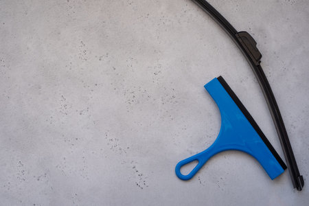 wiper blade and glass scraper. Glass Scrape tool or Squeegee for Shower, Window and Car Glass on white backgroundの写真素材