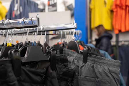 Sportswear is hung on the clothes line in the mall for sale to athletes. To exercise. concept of buy , sell , shopping and sport fashion.の写真素材