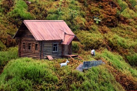 Miniature of realistic rural countryside landscape with a wooden windmill and people. composition of live moss grown in a greenhouse. Space for your textの写真素材