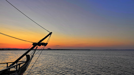 the bow of the ship against the sunset