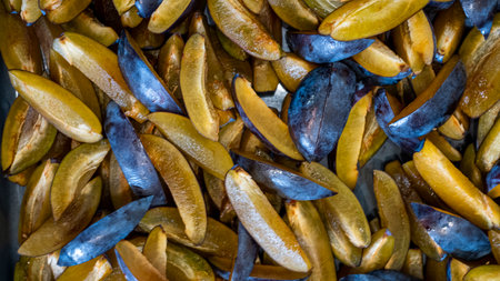 cut into slices plum. photo to use as a background, pattern, for paintings and panels, puzzles.の写真素材