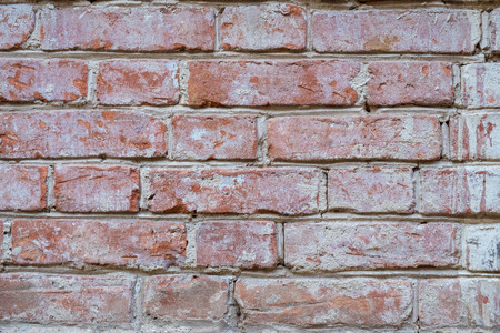 Old wall of red bricks tiled background, regular block texture. Wallpaper of ordinary building. Tiles. Backgroundの写真素材