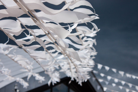 Small triangular waving flagsの写真素材