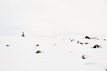 lighthouse in winterの写真素材