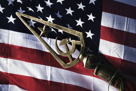 usa flag and soviet symbol: star, hammer and sickle.の写真素材