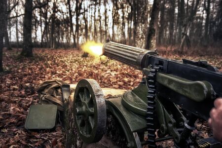 retro machine gun in the forestの写真素材