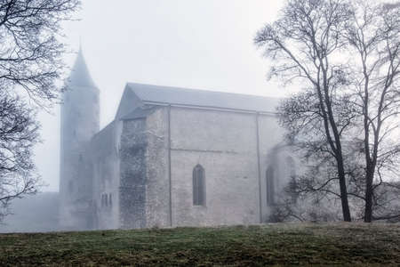 bishop's castle in the morning fog. Estonia, Haapsalu cityのeditorial素材
