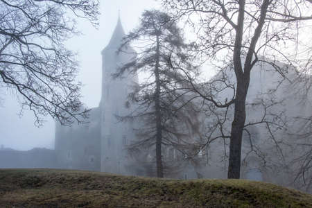 bishop's castle in the morning fog. Estonia, Haapsalu cityのeditorial素材