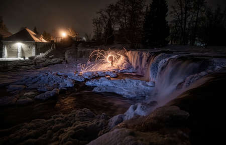 night view of winter waterfall Keila in Estoniaの写真素材