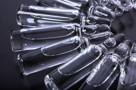 Studio photo medical ampoules on a black backgroundの写真素材